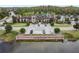Beautiful neighborhood clubhouse, The Club at Estancia, with lush landscaping and ample parking at 29043 Picana Ln, Wesley Chapel, FL 33543