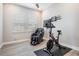 Bright and airy exercise room featuring modern workout equipment and a comfortable massage chair at 29043 Picana Ln, Wesley Chapel, FL 33543