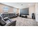 Home theater includes a projector screen, leather sofa, and surround sound at 29043 Picana Ln, Wesley Chapel, FL 33543
