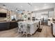 Bright, open kitchen with large island, stainless steel appliances, and pendant lighting creates inviting space at 29043 Picana Ln, Wesley Chapel, FL 33543