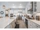 Bright kitchen with white cabinetry, a large island, and stainless steel appliances at 29043 Picana Ln, Wesley Chapel, FL 33543