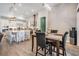 Stylish kitchen with a large island, adjacent to a dining area with natural light at 29043 Picana Ln, Wesley Chapel, FL 33543