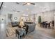 Expansive living room with open layout, seamlessly connecting the kitchen, dining, and seating areas at 29043 Picana Ln, Wesley Chapel, FL 33543