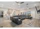 Spacious open-concept living area featuring modern kitchen, dining space, and comfortable seating at 29043 Picana Ln, Wesley Chapel, FL 33543