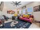 This home office is decorated with sports memorabilia and a ceiling fan at 29043 Picana Ln, Wesley Chapel, FL 33543