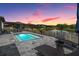 Inviting pool area with lounge chairs and serene pond views, perfect for relaxation and enjoying the sunset at 29043 Picana Ln, Wesley Chapel, FL 33543