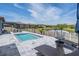 Beautiful pool area with comfortable lounge seating and a tranquil view of the adjacent pond at 29043 Picana Ln, Wesley Chapel, FL 33543