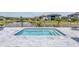 Gorgeous private pool with beautiful stone surround and a relaxing view of the water at 29043 Picana Ln, Wesley Chapel, FL 33543