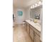 Clean bathroom featuring double sinks, modern fixtures, and neutral tones, offering a functional and stylish space at 28166 S Twin Lakes Dr, Punta Gorda, FL 33955