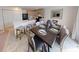 Open concept dining area features a modern table set, island with barstool seating, and contemporary decor at 28166 S Twin Lakes Dr, Punta Gorda, FL 33955