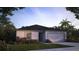 Beautiful single-story home featuring a two-car garage and a well-maintained front yard with lush landscaping at 28166 S Twin Lakes Dr, Punta Gorda, FL 33955