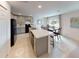 Modern kitchen featuring sleek appliances, ample counter space, and an island with seating, perfect for entertaining at 28166 S Twin Lakes Dr, Punta Gorda, FL 33955