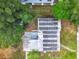 Birds eye view of house with solar panels installed on the roof at 8231 Riverside Ne Dr, St Petersburg, FL 33702
