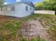Backyard view featuring some grass and a privacy fence at 1736 Taylor Lake Pl, Largo, FL 33778