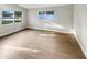 Bright and airy bedroom with hardwood floors and a great view through the room's windows at 1736 Taylor Lake Pl, Largo, FL 33778
