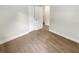 Comfortable bedroom featuring wood-look flooring and a spacious closet at 1736 Taylor Lake Pl, Largo, FL 33778