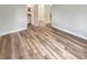 This bedroom features modern wood-look flooring and ample open space at 1736 Taylor Lake Pl, Largo, FL 33778