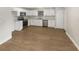 Bright kitchen featuring stainless steel appliances, ample counter space, and wood-look flooring at 1736 Taylor Lake Pl, Largo, FL 33778