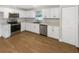 Modern kitchen featuring stainless steel appliances, sleek countertops, and ample cabinet space at 1736 Taylor Lake Pl, Largo, FL 33778