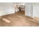 Bright, spacious living room featuring hardwood floors and an open layout with views to the kitchen at 1736 Taylor Lake Pl, Largo, FL 33778
