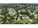 Aerial view highlighting the neighborhood's convenient access to waterfront activities, shopping, and dining, all near a lake at 3565 E Lake Dr, Land O Lakes, FL 34639