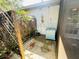 An outdoor back patio area featuring weathered wood features and faded blue storage bin at 3565 E Lake Dr, Land O Lakes, FL 34639
