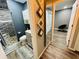 A modern bathroom showcases a stylish vanity, decorative accents, and a convenient mirror leading to bedroom at 3565 E Lake Dr, Land O Lakes, FL 34639