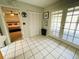 Entryway with tiled floor, closet space, and access to backyard and bedroom at 3565 E Lake Dr, Land O Lakes, FL 34639