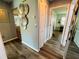 Hallway leading to open living space, adorned with decorative wall art at 3565 E Lake Dr, Land O Lakes, FL 34639
