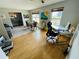 Open living space featuring both a dining and office area and wood flooring at 3565 E Lake Dr, Land O Lakes, FL 34639