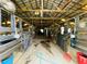 Interior view of the horse stables, with stalls and equipment at 3565 E Lake Dr, Land O Lakes, FL 34639