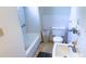 Bathroom with a bathtub, toilet, and sink, featuring tiled walls and flooring at 4719 Alcazar S Way, St Petersburg, FL 33712