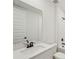 Modern bathroom featuring sleek fixtures, a spacious mirror, and a clean design at 13828 Richland Gulf Cir, Parrish, FL 34219