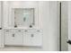 Bathroom features dual sinks with marble countertops and a large mirror at 13828 Richland Gulf Cir, Parrish, FL 34219