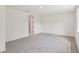 Neutral bedroom with carpet floors and a view into the bathroom at 13828 Richland Gulf Cir, Parrish, FL 34219