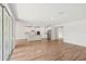 Spacious living room with seamless flow into kitchen area and sliding glass door to outside at 13828 Richland Gulf Cir, Parrish, FL 34219