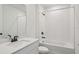 Clean bathroom featuring a shower-tub combo, and modern sink with dark faucet at 1780 Draughton Dr, Zephyrhills, FL 33541