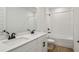 Bathroom with double sink vanity, white quartz counters, tub, shower, and wood-look tile at 1780 Draughton Dr, Zephyrhills, FL 33541
