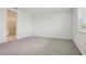 Bedroom featuring plush carpeting and an en suite bathroom at 1780 Draughton Dr, Zephyrhills, FL 33541
