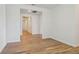 Bright hallway with wood-look tile flooring and neutral walls leading to other rooms at 1780 Draughton Dr, Zephyrhills, FL 33541