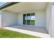 Covered patio with sliding glass doors at 1780 Draughton Dr, Zephyrhills, FL 33541