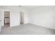 Neutral bedroom with carpeted floors and an ensuite bathroom at 1828 Brekey Way, Zephyrhills, FL 33541