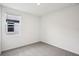 Unfurnished bedroom with plush carpeting, neutral paint, and ample natural light at 1828 Brekey Way, Zephyrhills, FL 33541