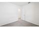 Empty bedroom with carpeted floors, white walls, and a closet with an open door at 1828 Brekey Way, Zephyrhills, FL 33541