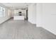 Bright living space with tile floors flowing into an open kitchen area at 1828 Brekey Way, Zephyrhills, FL 33541