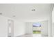 Bright and airy room with a sliding glass door offering views of the backyard at 1828 Brekey Way, Zephyrhills, FL 33541