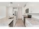 Modern kitchen with stainless steel appliances, granite countertops, and white cabinetry at 1847 Brekey Way, Zephyrhills, FL 33541