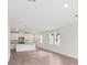 Open floor plan showcasing the kitchen, dining area, and the modern neutral decor throughout at 1847 Brekey Way, Zephyrhills, FL 33541