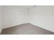 A bedroom with carpet and a double door closet provides ample storage space at 1855 Brekey Way, Zephyrhills, FL 33541