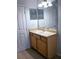 Bathroom featuring a vanity with cabinets and a mirror at 5000 Culbreath Key Way # 9-101, Tampa, FL 33611